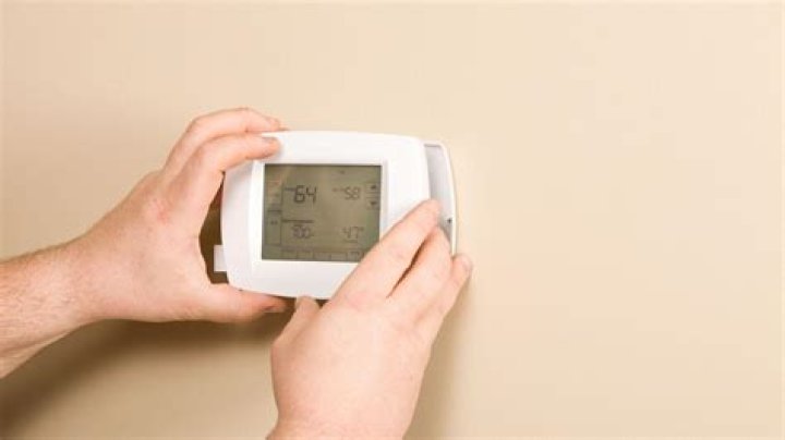 How do you unlock a Totaline thermostat?