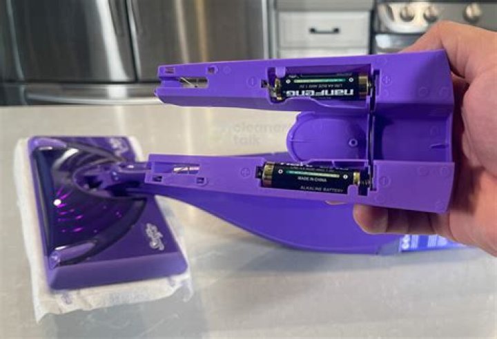 Where do the batteries go on a Swiffer Wet Jet?